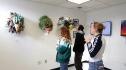 Image of people looking at artwork during a Finley Gallery exhibition