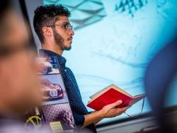 Photo of student talking in a CART Industrial Design classroom