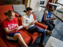 Students playing video games together