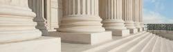 photo of white legal building steps with large stone columns