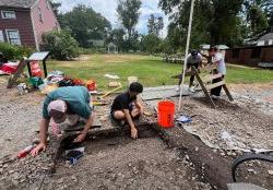 photo of students & staff on archaeology dig at Montclair History Center