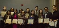 Scholarship Recipients holding their certificates.