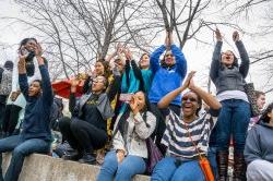 Group of students looking excited and clapping