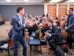 Students on the winning team, Wheatpaste, celebrate as their name is called at the 2018 BulbHead pitch contest.