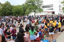 Students milling around in the quad at the Greek Fair.