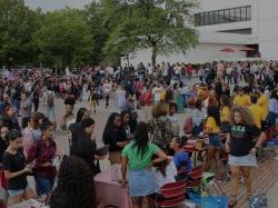 Students milling around in the quad at the Greek Fair.