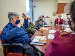 Members of the Aphasia Book Club seated around a table