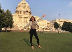 Photo of Isabella Paz Baldrich on the lawn in front of the U.S. Congress building