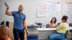 Workshop leader teaches in a classroom.