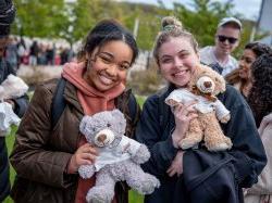 Two students with teddy bears.