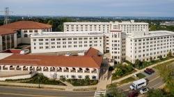 The exterior of Machuga Heights and Sam's place from an aerial view.