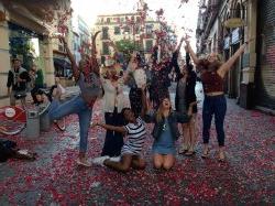 Dance students throwing rose petals in Sevilla