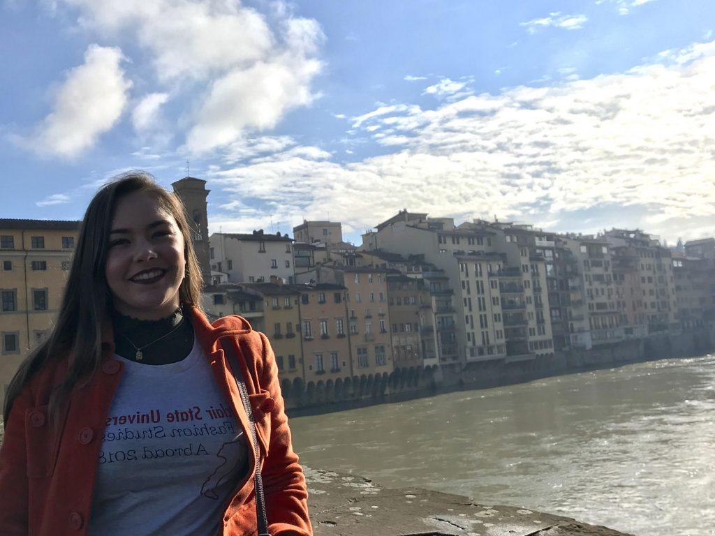 Student posing on pedestran bridge in Wolfersberger